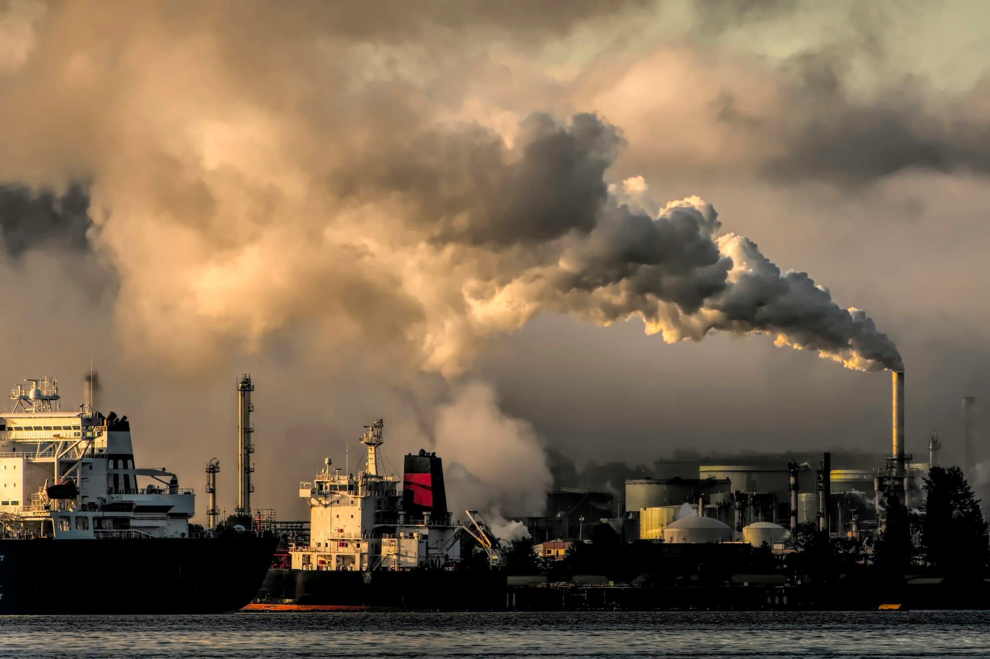 A tanker beside an energy terminal at dusk